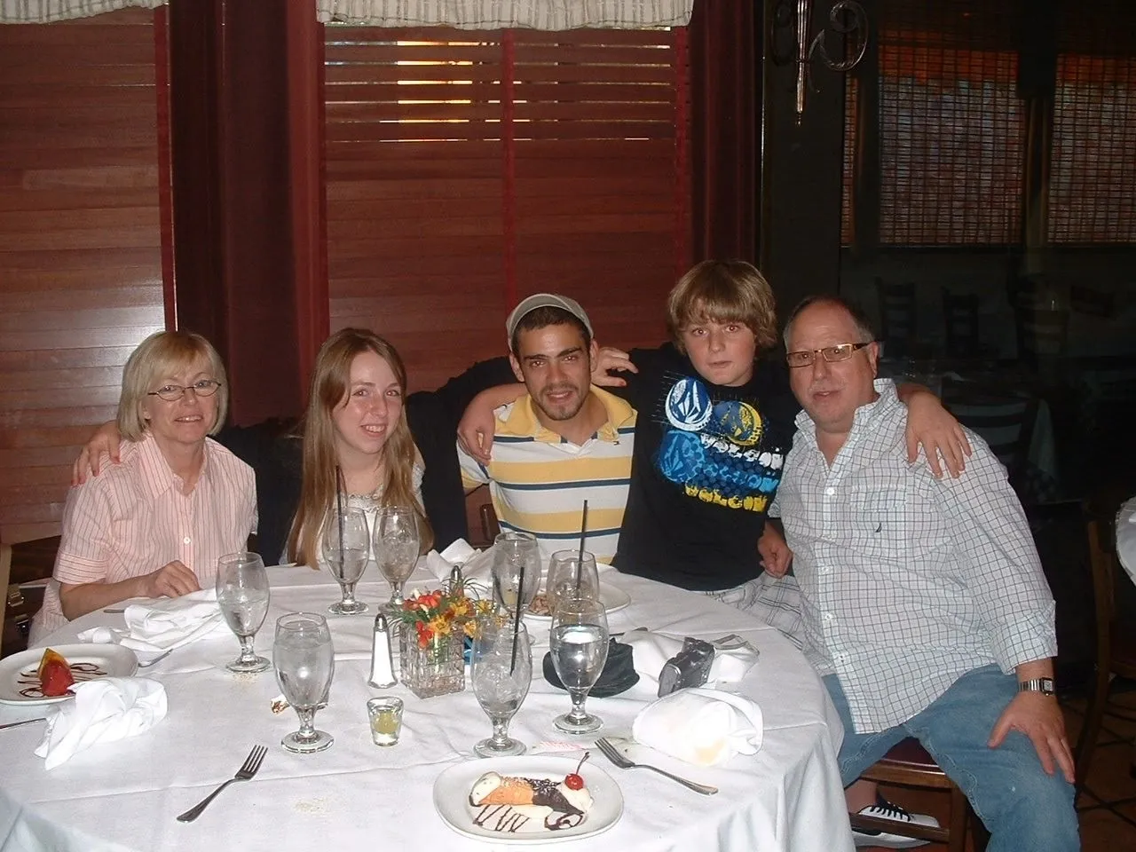 The Shefska family gathered around a dinner table